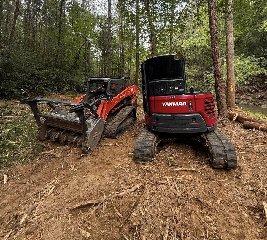 A forestry mulcher attachment working in standing timber.
