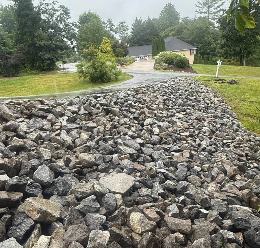 Riprap stone placed to armour a slope against erosion.